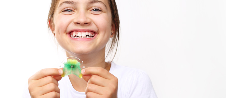 Child with orthodontic appliance