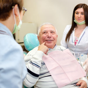 Senior man 70-75 years old, having visited the dental office for treatment