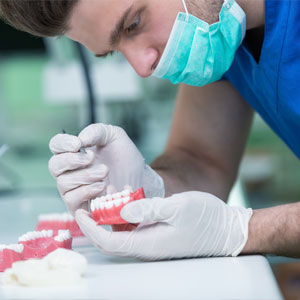 Prosthetics hands while working on a denture